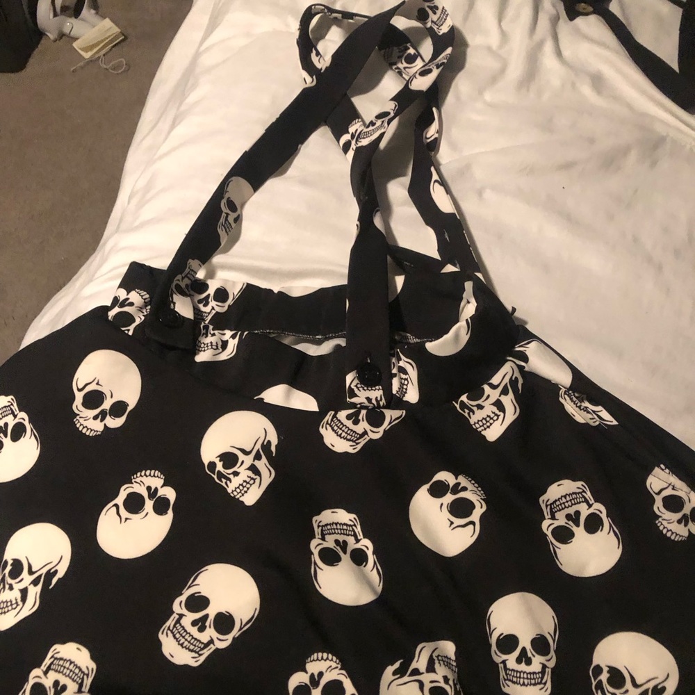 Black skull criss cross overalls